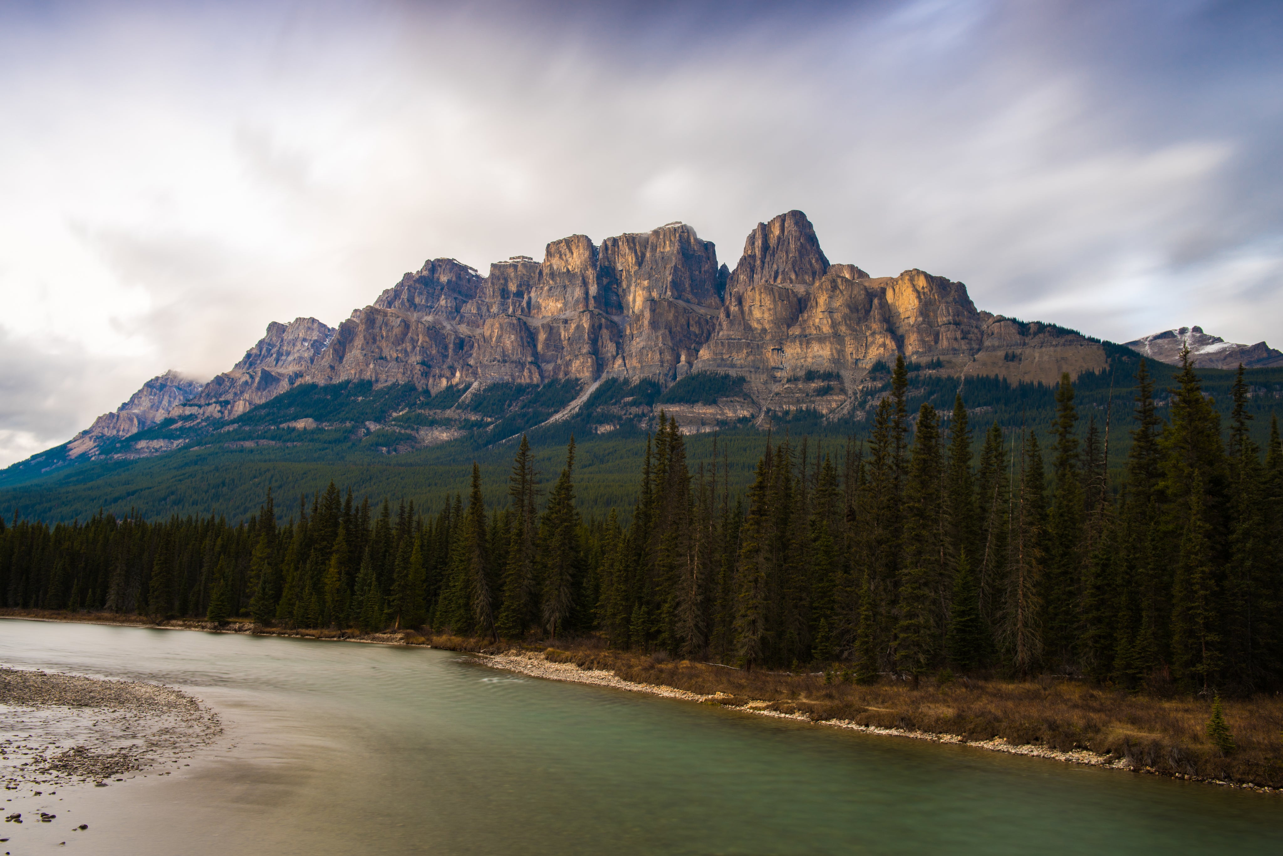 castle-mountain-towering-over-lush-alberta-forest.jpg